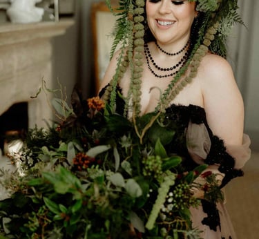a woman in a dress with a deer antler headdress