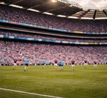 Blurred view of a hurling match in a packed Croke Park stadium with fans in the stands.