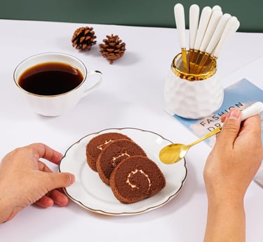 a person is holding a spoon and spoon in their hand