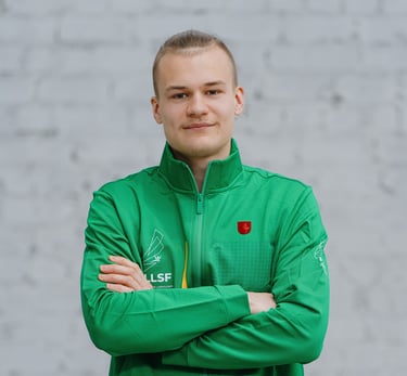a man in a green jacket and crossed arms
