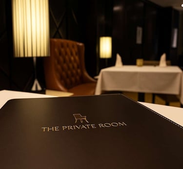 menu folder on a table in a dimly lit lounge
