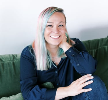 Tabitha with butterfly effect consulting on a couch