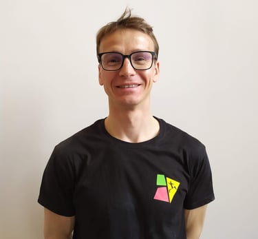 a man with glasses and a black shirt