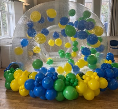 Bubble house with balloon garland set up in tunbridge wells 