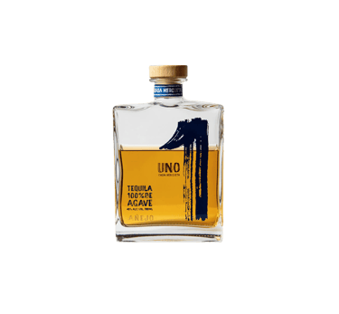 a bottle of uno tequila añejo - premium tequila añejo