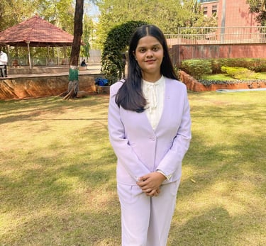 a woman in a white suit and white shoes