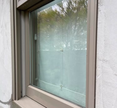 Spotless window after professional window cleaning in Clovis CA by Spartan Home Services