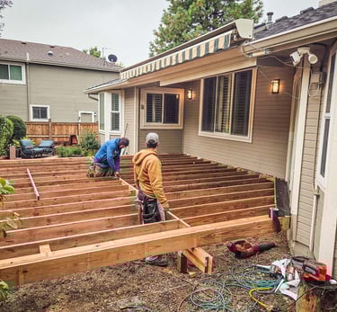 Custom deck framing project behind a home in Lakewood CO