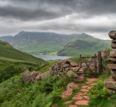 A view of a stone wall and gate looking towards Crummock Water in the Lake District ©Mick Howard