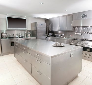 Premium stainless steel home kitchen with custom island and cabinetry, available for a custom quote.
