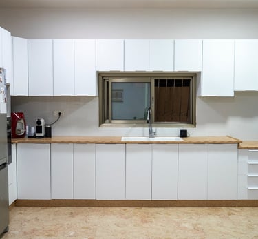 a kitchen with a refrigerator and a refrigerator freezer