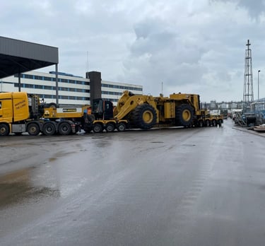 a large truck with a large loader on it