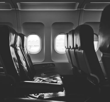 grayscale photo of airplane seats