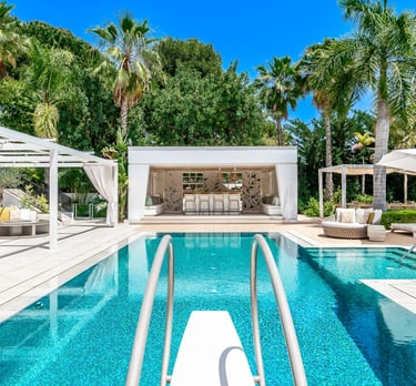 Pool area at Villa Serenity featuring modern furnishings, sunbathing lounges, and chill-out areas