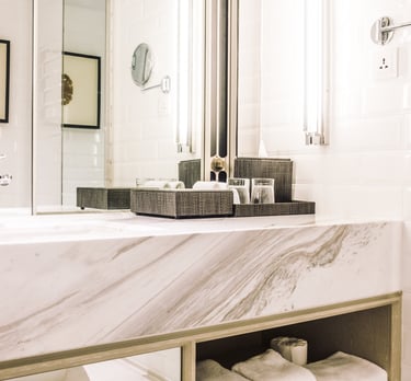 a bathroom with a marbled counter top