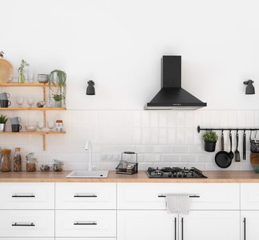 a kitchen with a stove top and shelves with pots and utensils