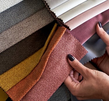 Interior designer Hands checking the quality of textile samples