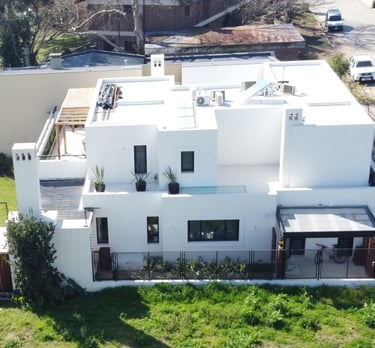 a house with a pool and a pool in the yard