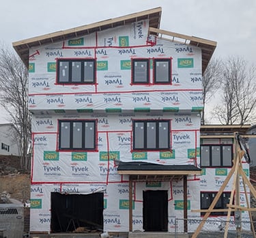 A 4-bedroom, 3-storey custom home built with SIP panels, currently under construction.