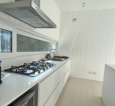 a kitchen with a stove top and a stove top