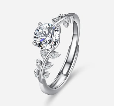 a diamond ring with a leaf design on the side