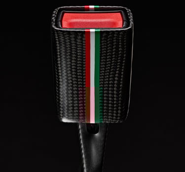 Product photography - a close up of a red, green and white seat belt