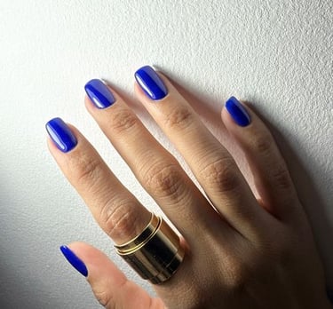 a woman's hand with a ring on her finger