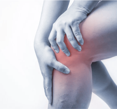 Person holding their knee in pain with a red highlight indicating inflammation or joint injury.
