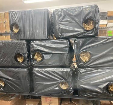 feral cat shelters filled with insulating straw for outdoor winter protection.