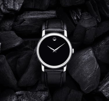 a black and white watch with a black and white watch face