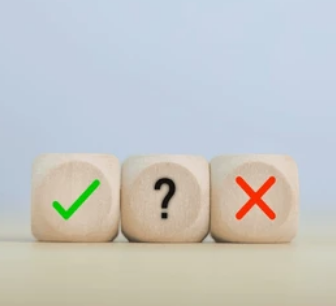 three wooden dice : ok, maybe, no