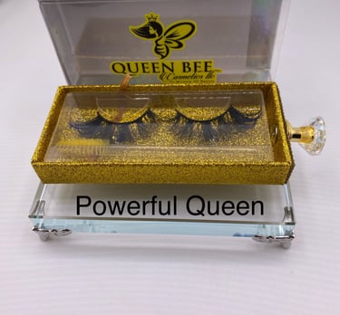 a box of eyelashes with a gold glittered eyeliner