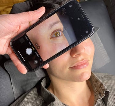 cellphone image of a woman's eye