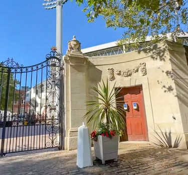 a gated entrance to a building with a gated entrance