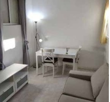 a living room with a couch and a television