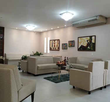 a living room with a couch and chairs