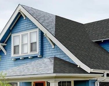 Picture of a roof showcasing old vs new roof on a house