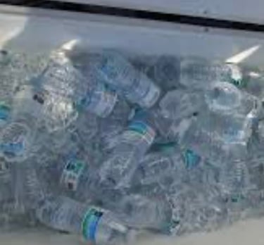 a coolerbox filled with water bottles of water