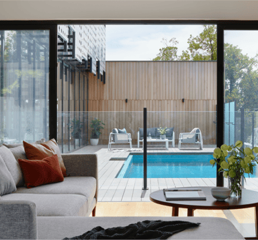 Modern luxury home exterior with pool – residential real estate transaction representation