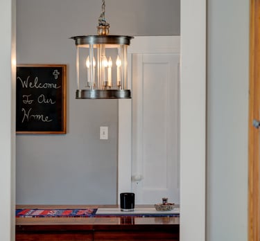a light fixture hanging over a dining room table