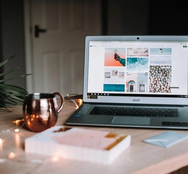 a laptop and a mug on a desk