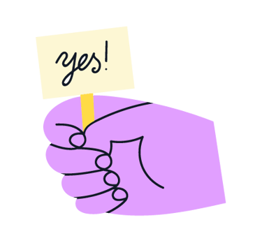 a hand holding a sign that says yes