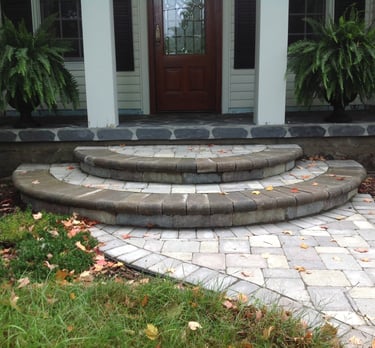 Leppek Landscapes designed and installed landscape paver walk way and porch. 