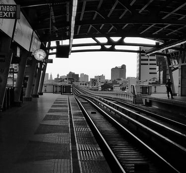 a train station with a train on the tracks