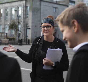 Film studio production company manager wearing a black jacket