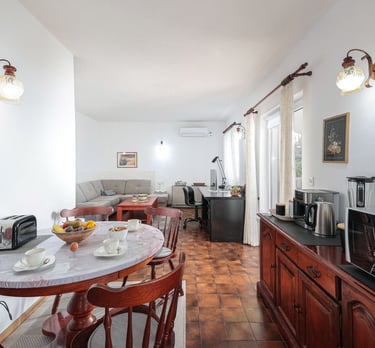 The photo shows an open-plan dining and living room.