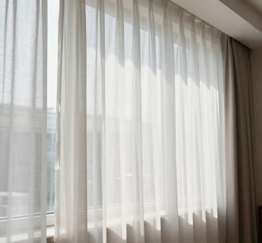 Outdoor patio with fiber glass planters and colorful cushions.