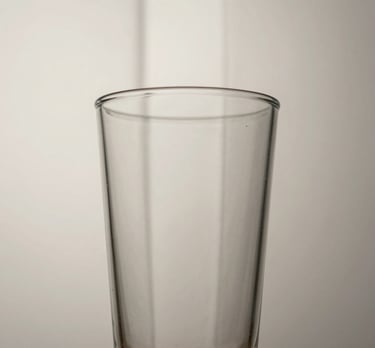 An abstract image of glass and light, representing clarity and transparency in business strategy. Off-white and light grey tones.