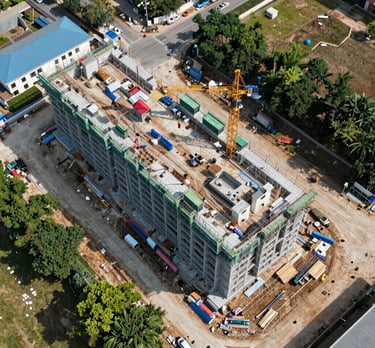 white quadcopter drone flying near snow mountain during daytime