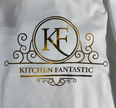 Elegant gold foil Kitchen Fantastic logo with KF monogram printed on a white garment.